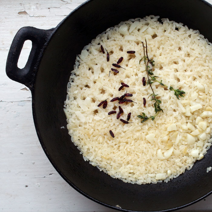 iron pot of rice and seasoning